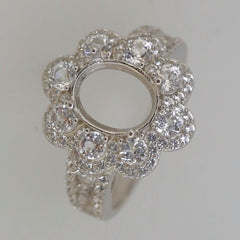 Sterling silver semi mount ring setting with oval halo floral design, perfect for custom gemstone placement.