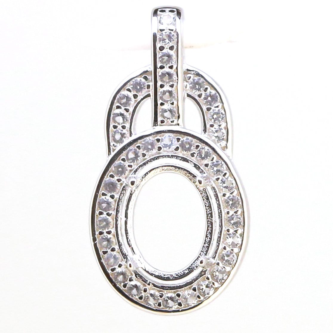 Sterling silver oval semi mount pendant setting with halo of D color moissanite, designed for custom gemstone sizing.