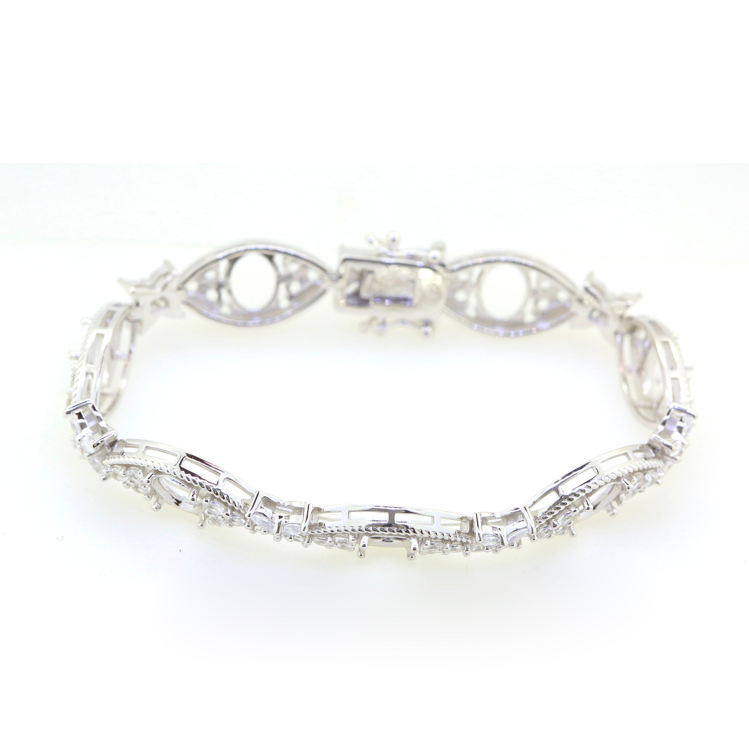 Sterling silver semi mount tennis bracelet setting with white topaz accent, showcasing elegant design and craftsmanship.