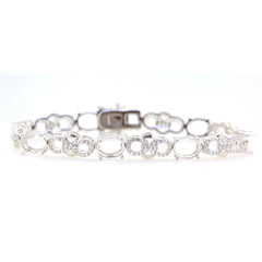 Sterling silver semi-mount tennis bracelet setting featuring oval accents and white topaz illustration.