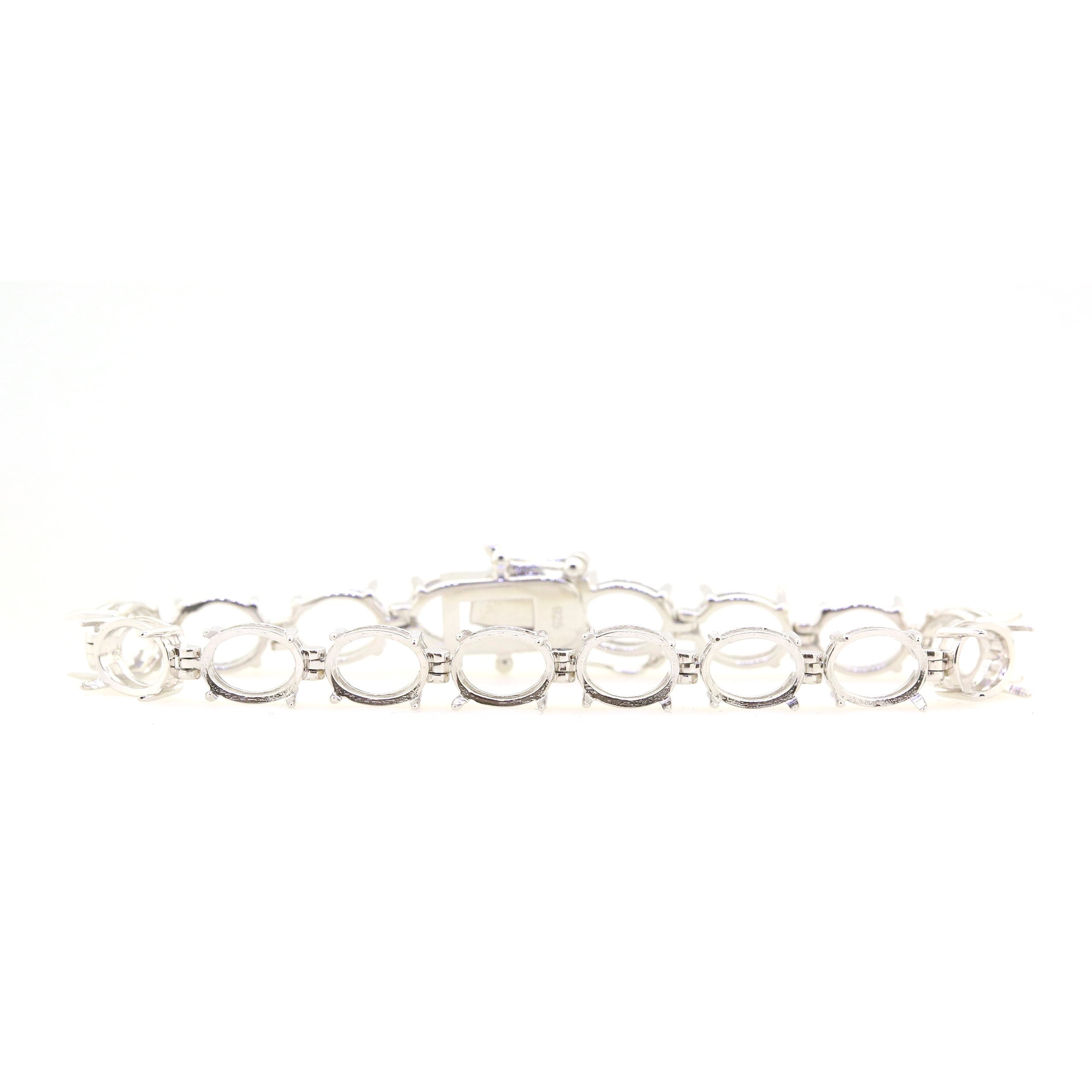 Sterling Silver Semi Mount Tennis Bracelet Setting with oval 9x7mm cabochon spaces, stainless steel tongue.