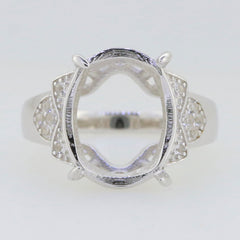 Sterling silver semi mount ring setting with oval halo design for 16x12mm gemstone, featuring white topaz accents.