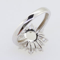 Sterling silver semi mount ring setting for 10x8mm oval stone with moissanite accents, showcasing intricate design.