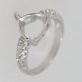 Sterling silver semi mount ring setting with moissanite accents, featuring a trillion shape for custom gemstones.
