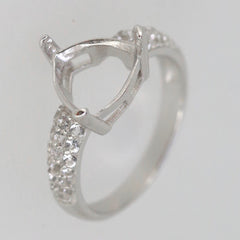 Sterling silver semi mount ring setting with moissanite accents, featuring a trillion shape for custom gemstones.