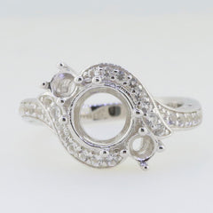Sterling silver semi mount ring setting featuring white topaz gemstones, designed for custom main gemstone placement.