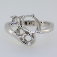 Sterling silver semi mount ring setting with oval and round gemstone placeholders for custom design.