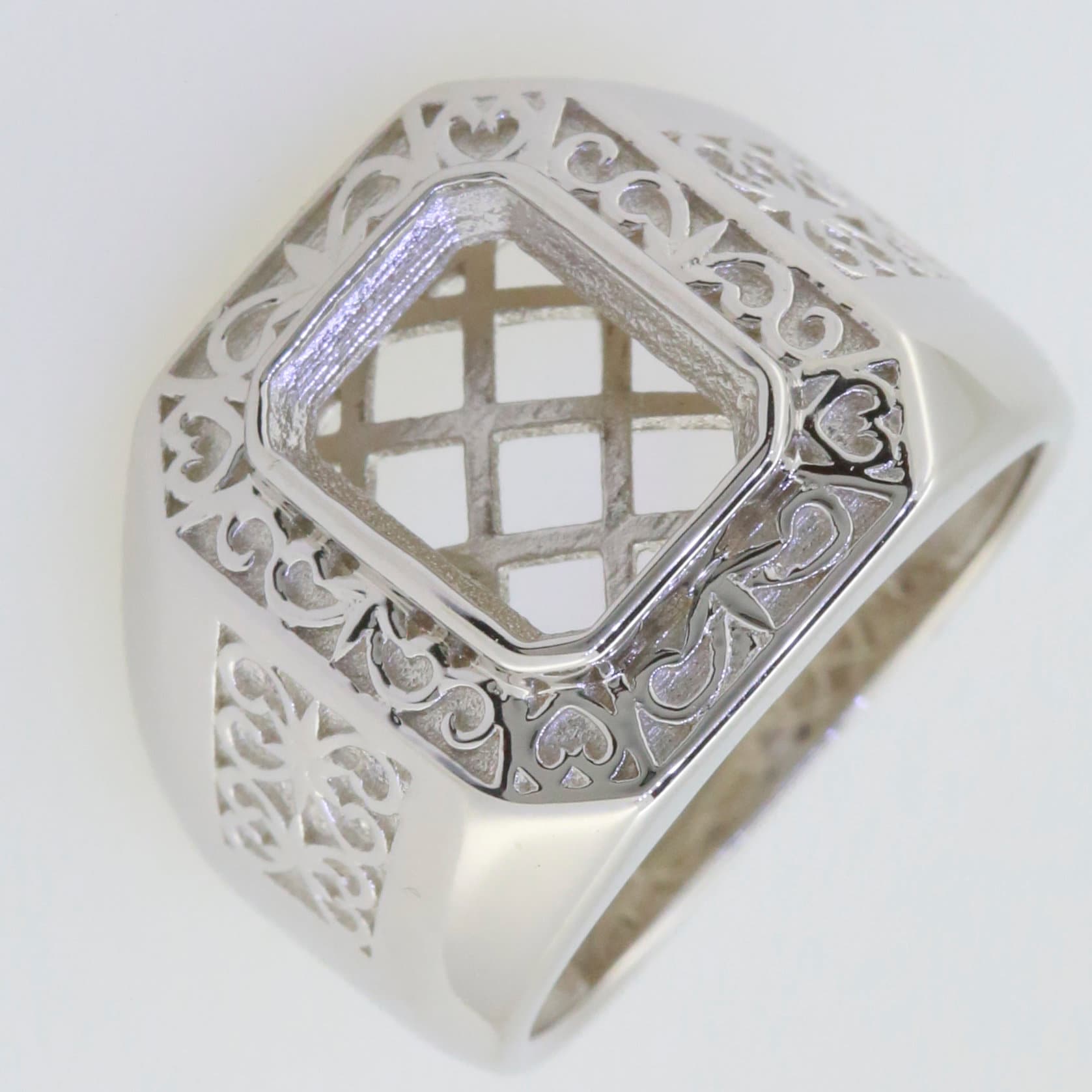 Men's sterling silver semi mount ring setting with intricate fleur de lis design and empty gemstone setting.