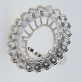 Sterling Silver semi mount ring setting with white topaz halo, designed for custom oval stone placement.