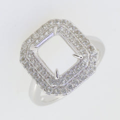 Sterling silver semi mount ring setting featuring double halo with white topaz, designed for 10x8mm emerald centerpiece.