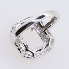 Sterling silver semi mount ring setting for emerald, featuring a double halo design and white topaz accents.