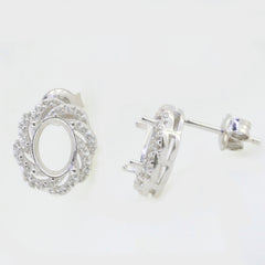 Sterling silver semi mount earrings setting with double halo design and white topaz accents, 8x6mm oval shape.