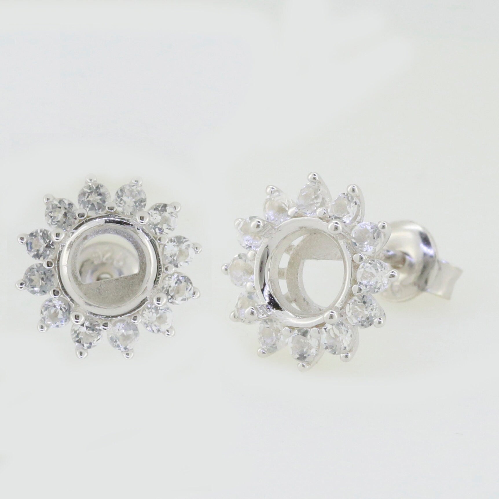 Sterling silver semi mount earrings setting with white topaz in double halo design, perfect for custom gemstone placement.