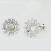 Sterling silver semi mount earrings setting with white topaz in double halo design, perfect for custom gemstone placement.
