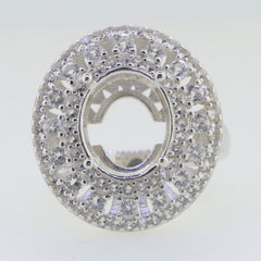 Sterling silver semi mount ring setting with triple halo design, featuring space for an oval stone and accent white topaz.
