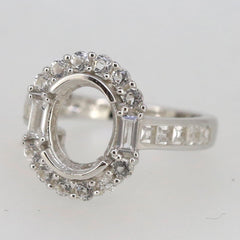 Sterling silver semi mount ring setting with oval halo and baguette stones for custom gemstone placement.