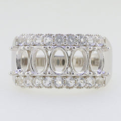 Sterling silver semi mount ring setting with oval and round white topaz accents, designed for customization.