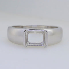 Sterling silver semi mount ring setting with a bezel for an emerald gemstone, designed to be made to order.