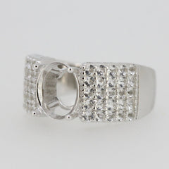 Sterling silver semi mount ring setting featuring an oval gemstone space and sparkling white topaz accents.
