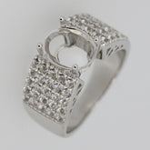 Sterling silver semi mount ring setting with oval stone placeholder and sparkling accents, ideal for custom gemstone.