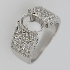 Sterling silver semi mount ring setting with oval stone placeholder and sparkling accents, ideal for custom gemstone.