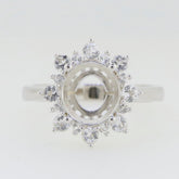 Sterling silver semi mount ring setting with halo and moissanite accents, designed for 10x8mm oval gemstones.