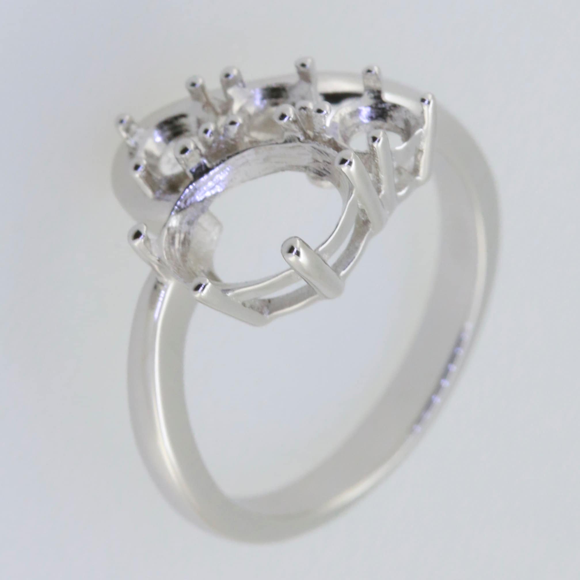 Sterling Silver Semi Mount Ring Setting, oval and round stone placements, perfect for custom gemstone jewelry.
