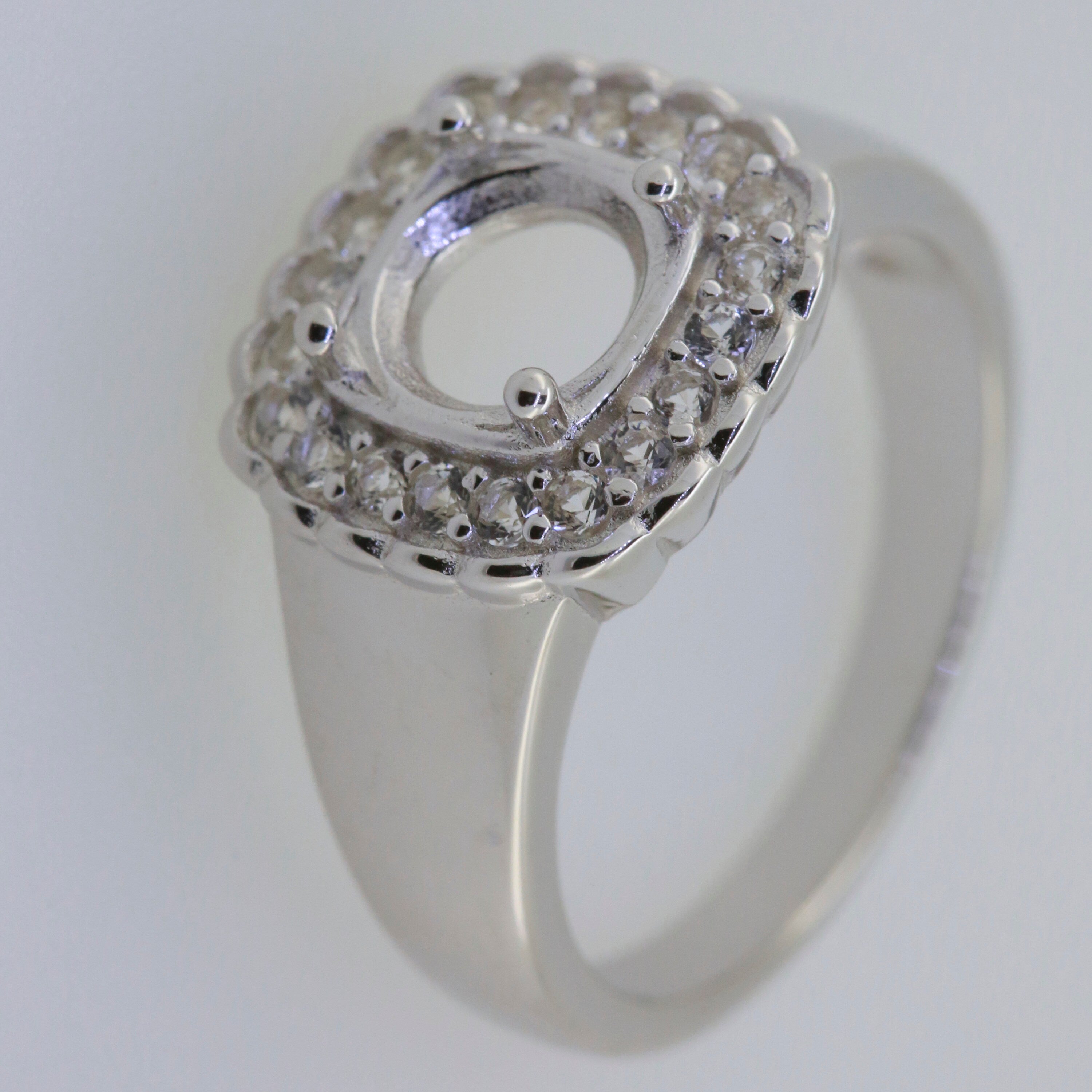 Men's sterling silver semi mount ring setting with round moissanite accents and empty center for customization.