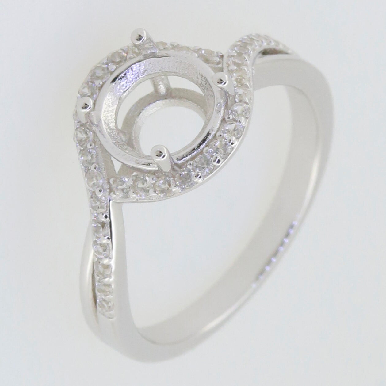 Sterling silver semi mount ring setting with halo design for 8x8mm round stone, featuring a bypass style.