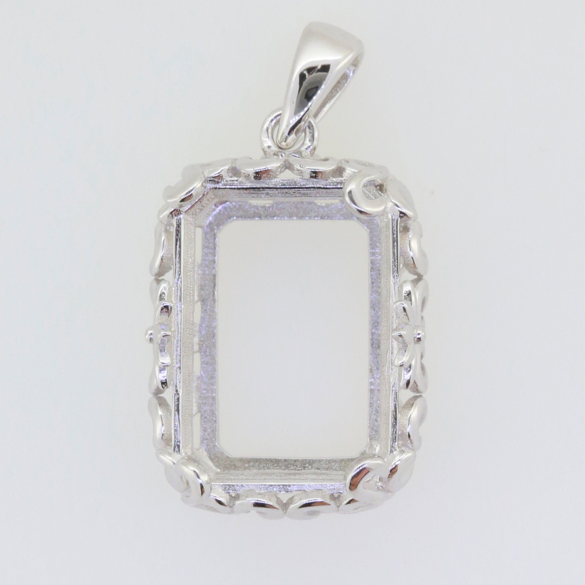 Sterling silver semi mount pendant setting, Art Nouveau style, designed for 18x13 emerald gemstones with white topaz accents.