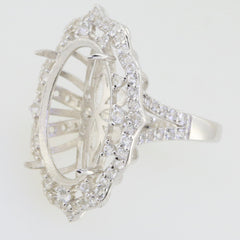 Sterling silver semi mount ring setting for 18x13mm oval cabochon, adorned with moissanite accent stones.