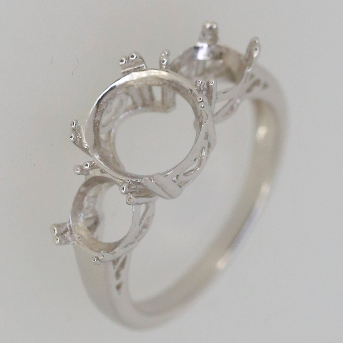 Sterling Silver Semi Mount Ring Setting featuring 3 stone design, designed for oval and round gemstones.