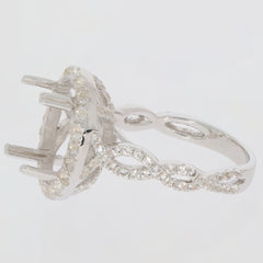 Sterling silver semi mount ring setting with twisted shank halo, designed for an oval gemstone, adorned with white topaz.