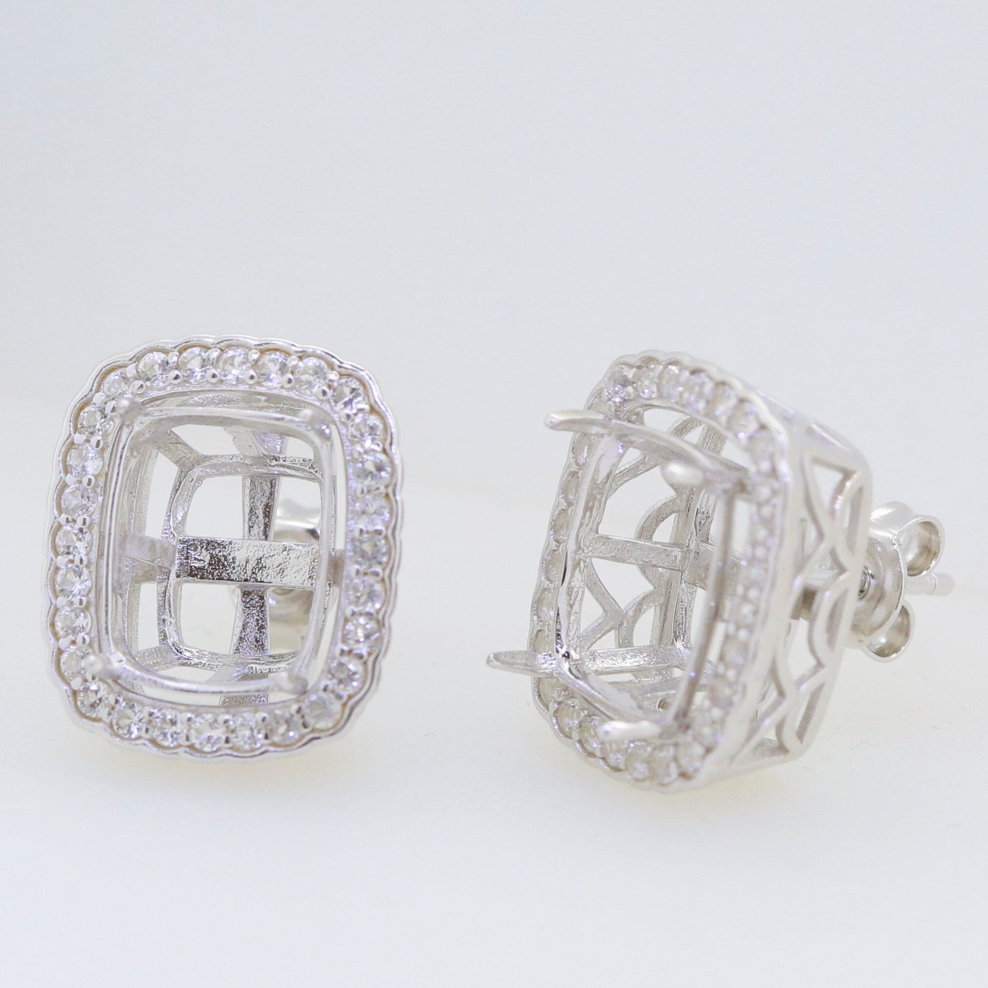 Sterling silver semi mount earrings setting with halo for cushion cut gemstones, featuring white topaz.