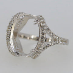 Sterling silver semi mount ring setting with halo design, featuring sparkling white topaz accents and an oval gemstone holder.
