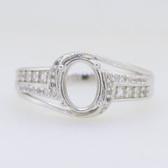 Sterling silver semi mount ring setting with oval stone space and moissanite accent gemstones for custom jewelry.