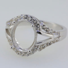 Sterling silver semi mount ring setting with oval center and moissanite accent stones, split shank design.