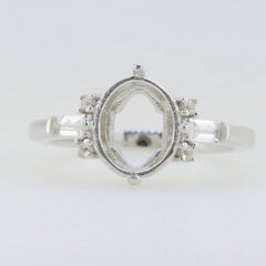 Sterling silver semi mount ring setting featuring oval 10x8mm with baguette accent, unembellished for custom gemstone setting.