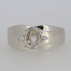 Sterling silver semi mount ring setting with oval space and moissanite accent stones, ready for customization.