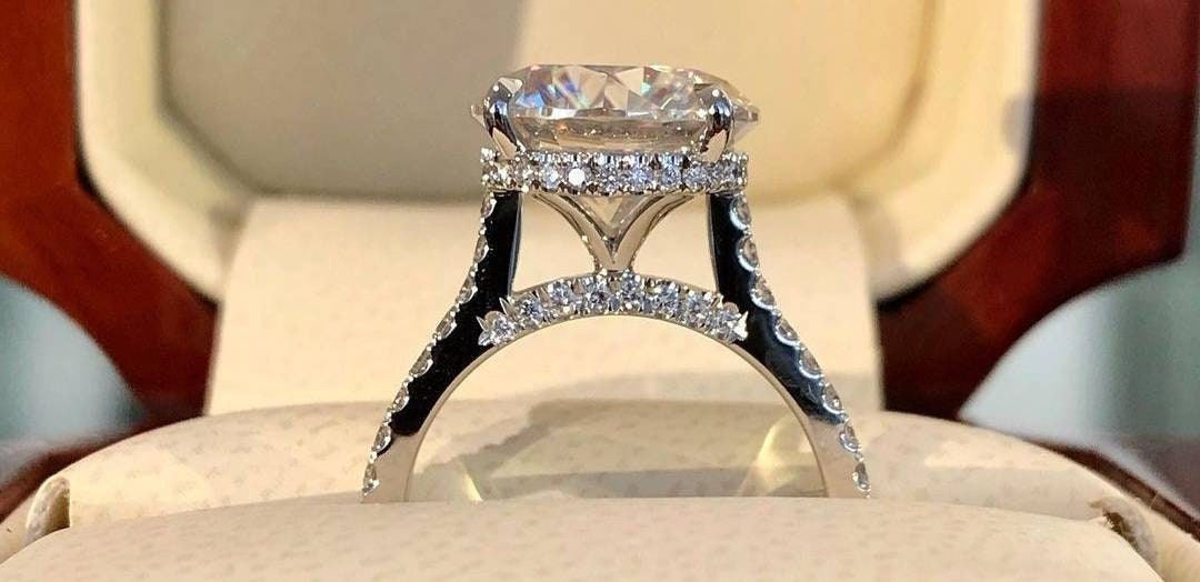 Sterling Silver semi mount ring setting with round 11mm halo and D color moissanite accents on pave band.