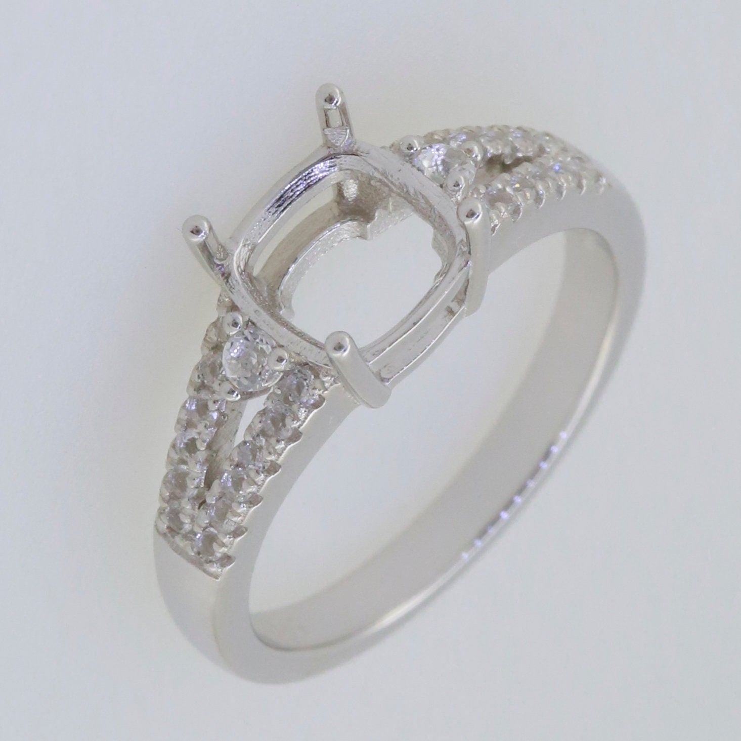 Sterling Silver semi mount ring setting with cushion cut and white topaz accents, designed for a 7x7mm gemstone.