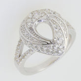 Sterling silver semi mount ring setting with white topaz accent in pear shape and split shank halo design.