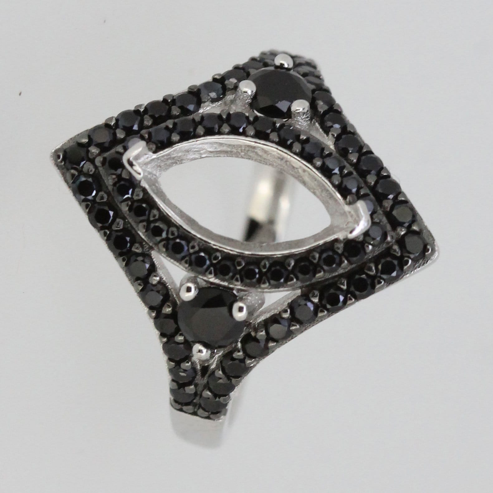Sterling silver semi mount ring setting with black spinel accent, featuring marquise shape design.