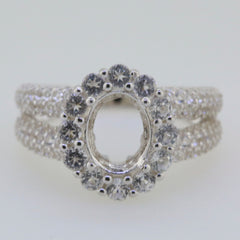 Sterling silver semi mount ring setting with oval center and halo of white topaz, split shank design.
