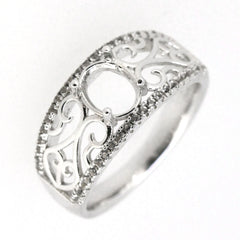 Sterling silver semi mount ring setting with filigree design, featuring an oval center and topaz accents.