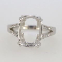 Sterling silver semi mount ring setting with an oval 14x10mm center and split shank design, featuring white topaz accents.