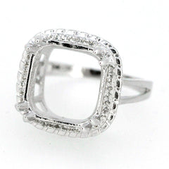 Sterling silver semi mount ring setting with halo design, featuring a square center for emerald and white topaz accents.