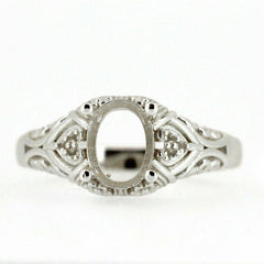 Sterling silver semi mount ring setting in Art Deco style, featuring intricate scrollwork for a 7x5mm oval gemstone.