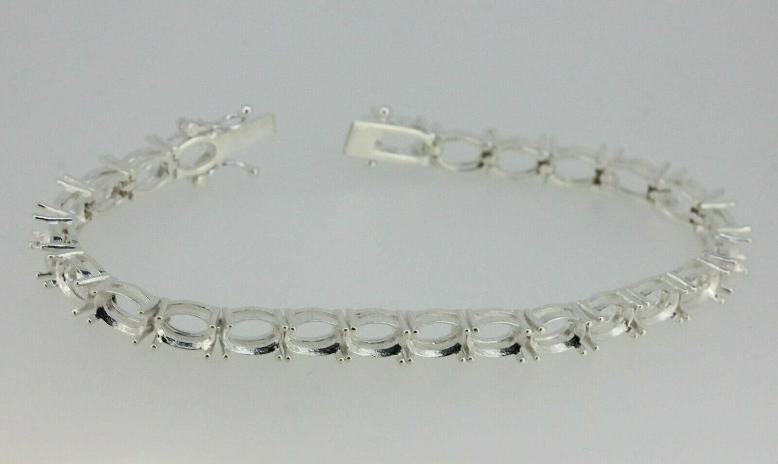 Sterling Silver Semi Mount Tennis Bracelet Setting with Oval 7x5mm Clasp, designed for customization.