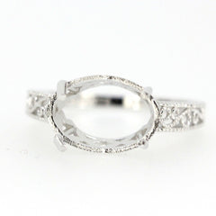 Sterling silver semi mount ring setting with art deco style scroll for 13x9mm oval gemstone.